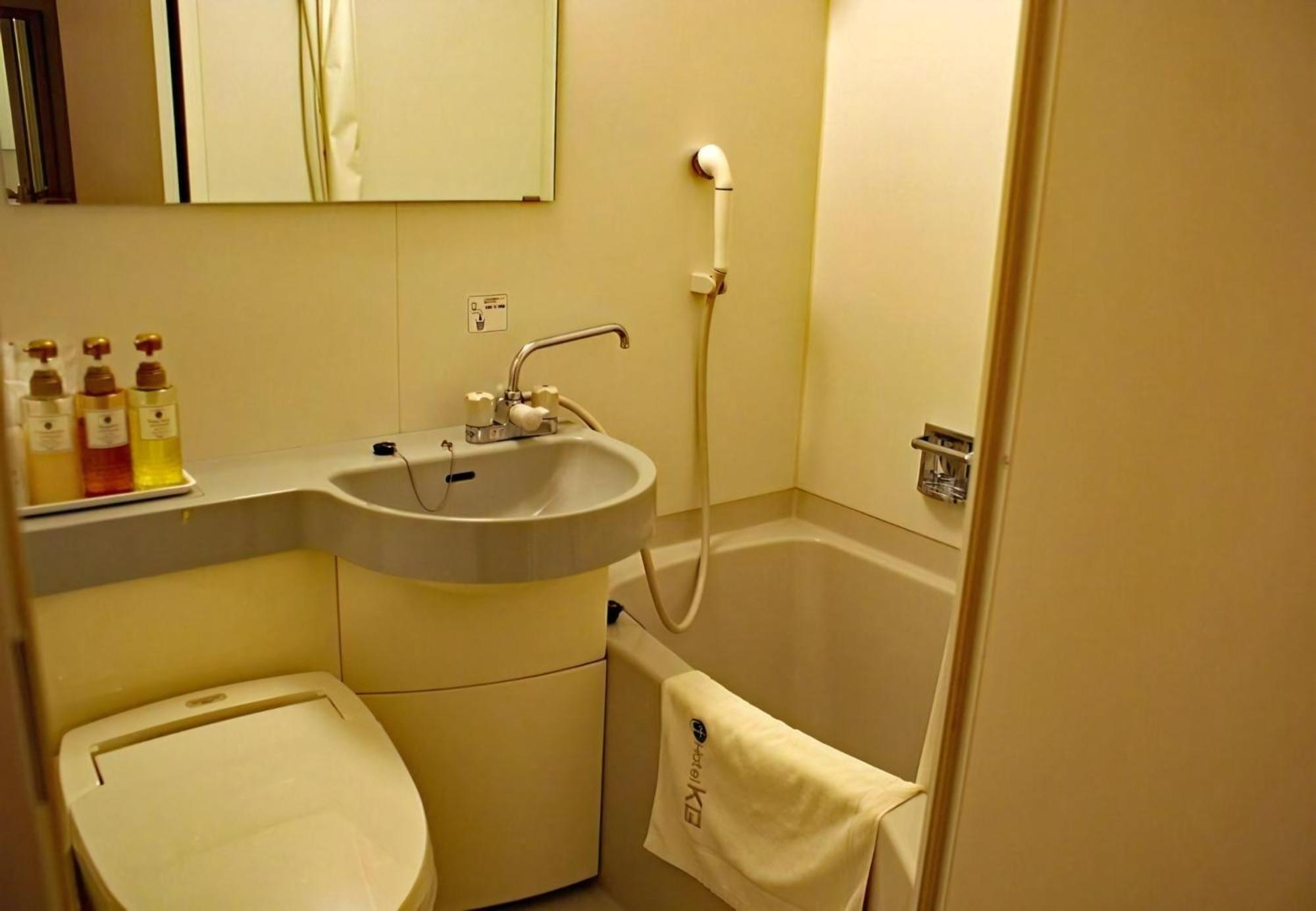 Business Hotel Kg Oita Bagian luar foto